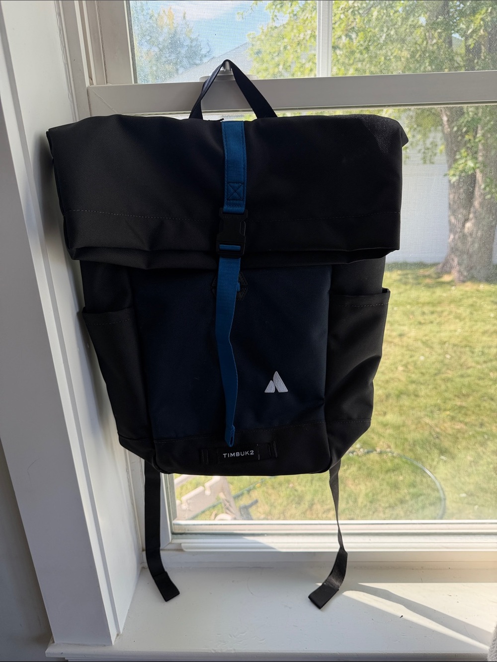Timbuk2 Black Roll-Top Backpack with Blue Strap Accent